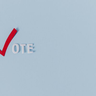 A Text Saying "Vote" on Light Blue Background