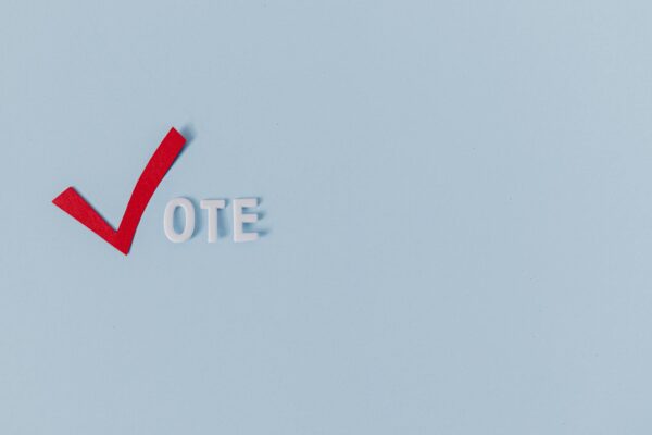 A Text Saying "Vote" on Light Blue Background